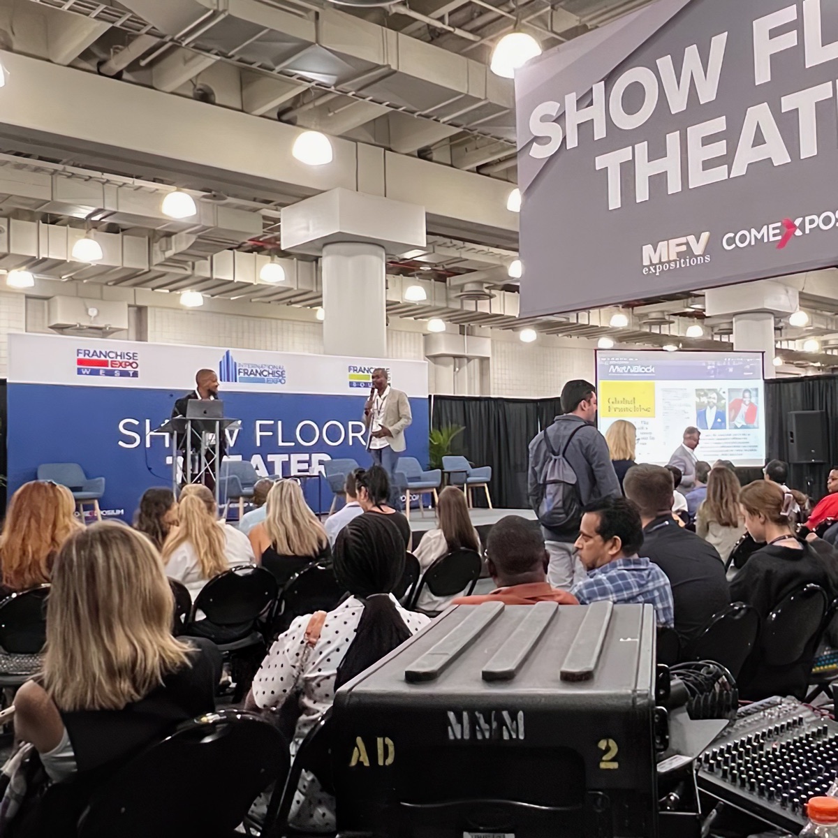 Charles Smart presenting on the Show Floor Theater stage at the International Franchise Expo